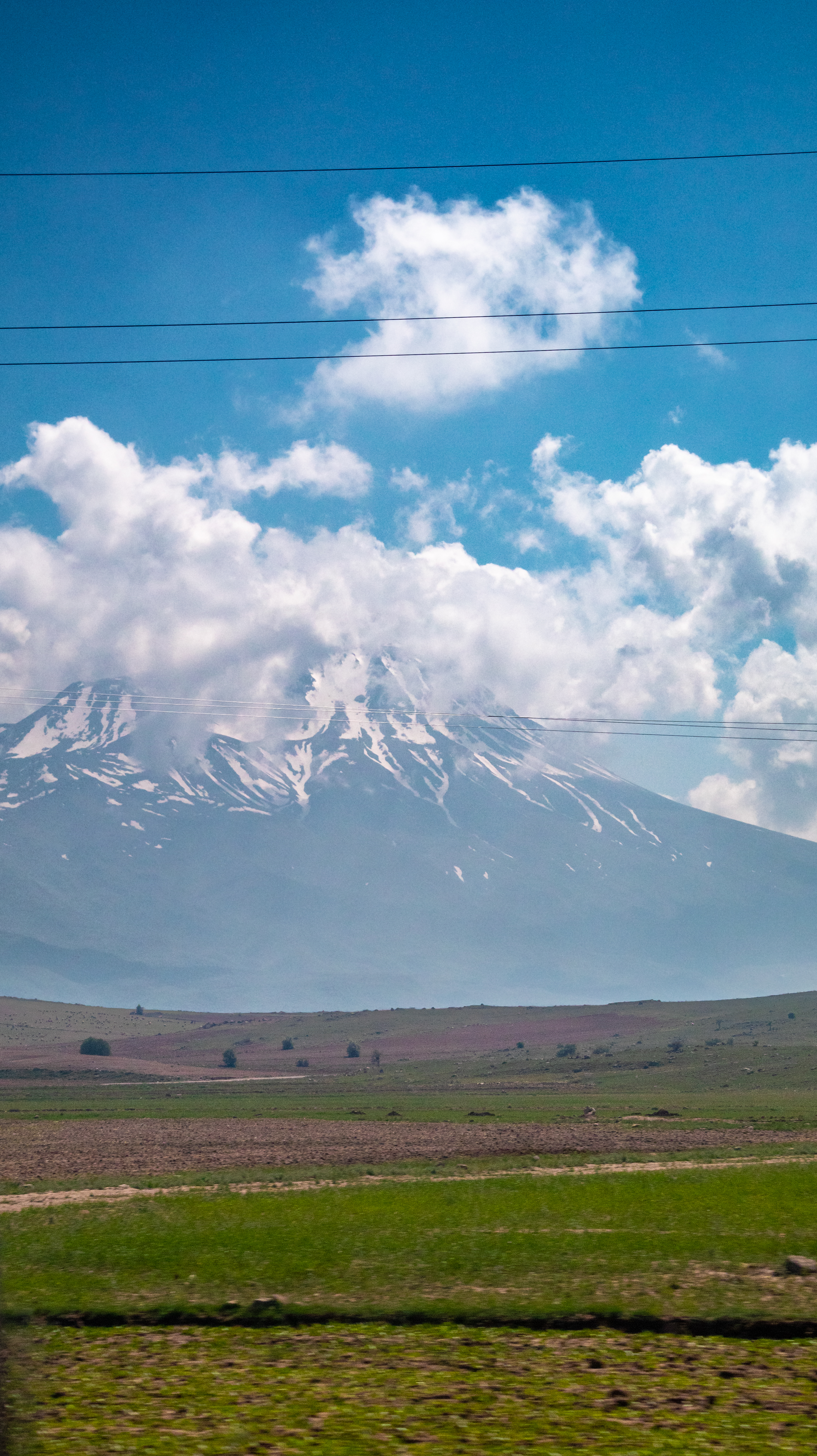 Snow-capped mountain under dramatic clouds, Turkey