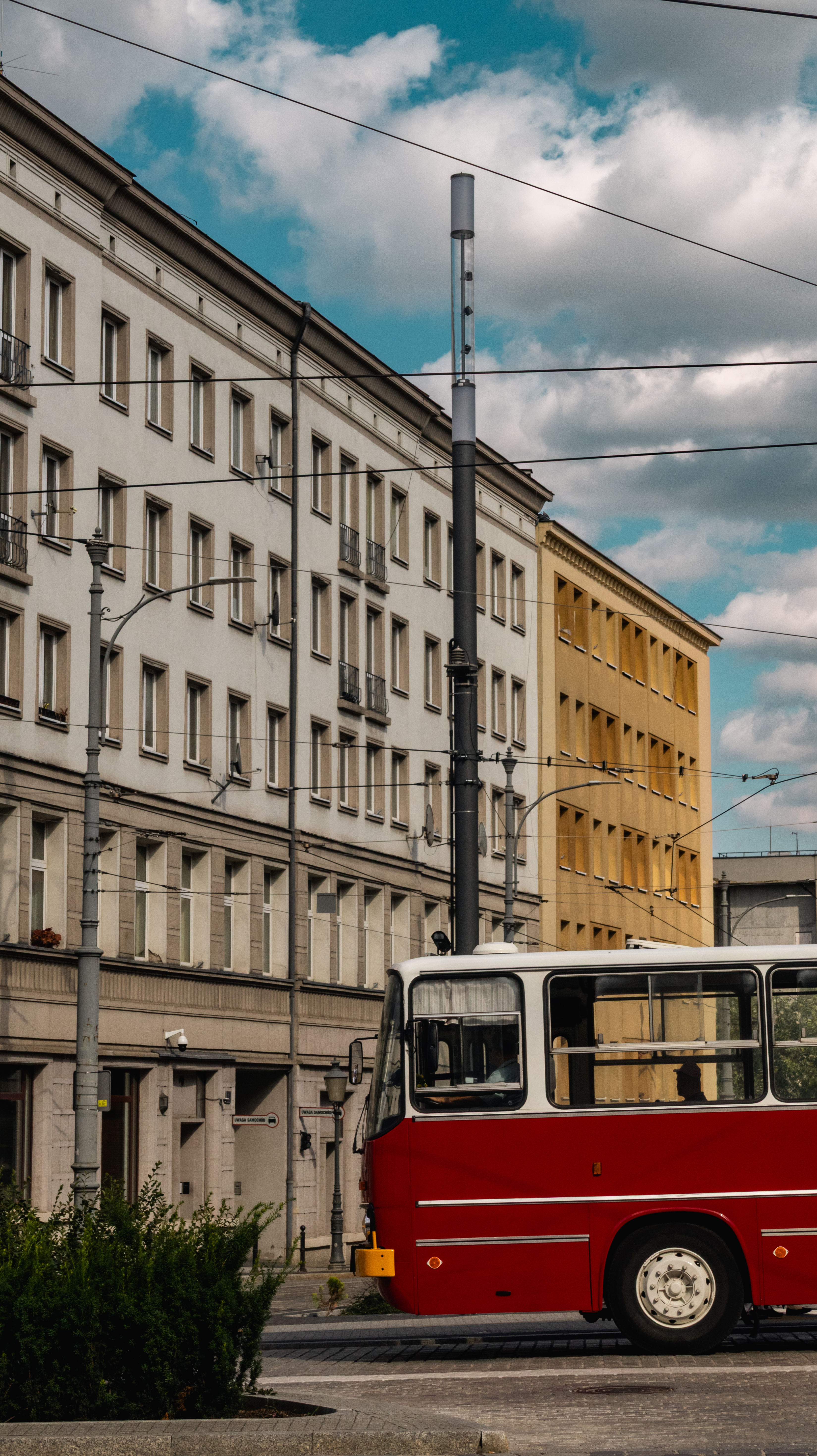 Vintage red bus on city street, Poland